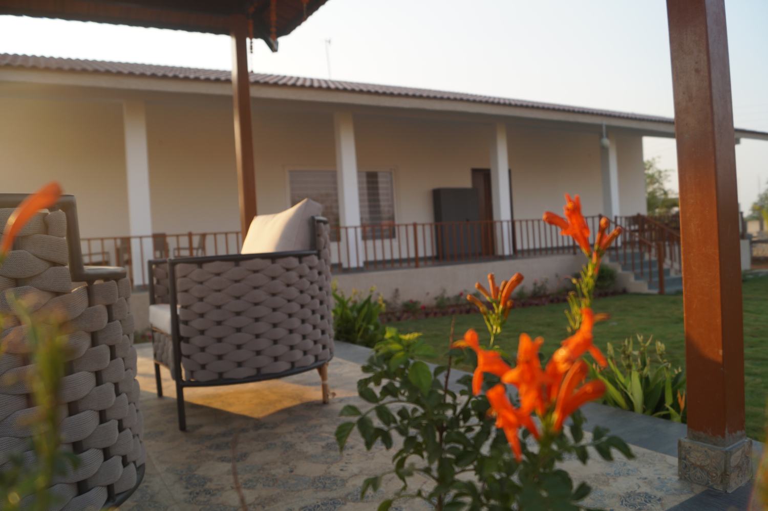 Courtyard flowers and villa seating at sunset